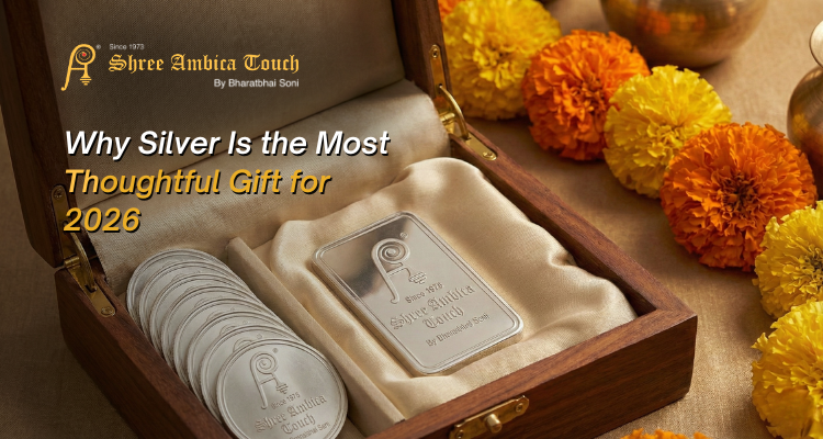 Silver coins and bars by Shree Ambica Touch displayed in a wooden box with marigold flowers, symbolizing auspicious gifting for 2026 weddings and celebrations.